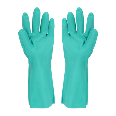 Il guanto del nitrile di verde di uso della cucina si è affollato allineare